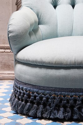 Lot 15 - A button-upholstered spoon-back armchair