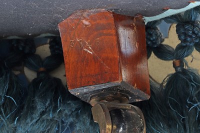 Lot 15 - A button-upholstered spoon-back armchair