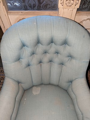 Lot 15 - A button-upholstered spoon-back armchair