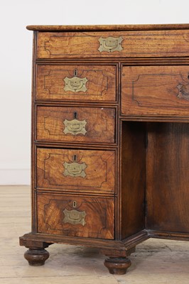 Lot 10 - A camphor wood and brass campaign desk