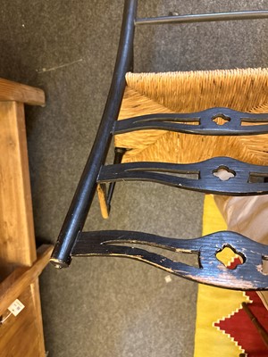 Lot 17 - An ebonised wooden elbow chair