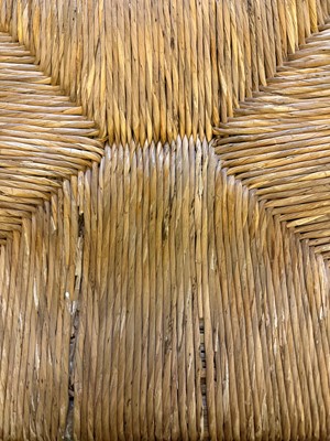 Lot 17 - An ebonised wooden elbow chair