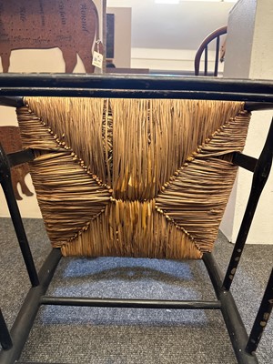 Lot 17 - An ebonised wooden elbow chair