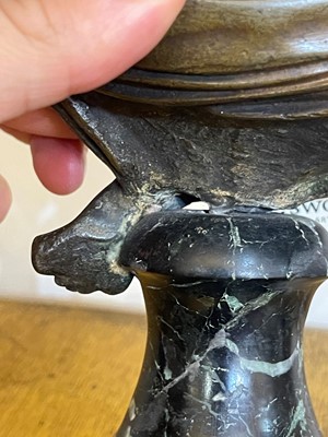 Lot 335 - A small patinated bronze bust of Napoleon
