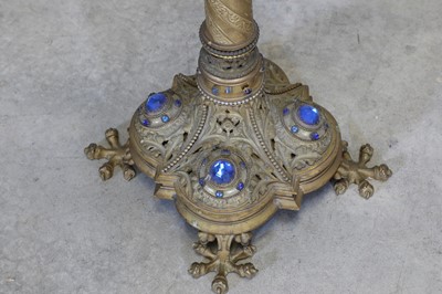 Lot 10 - A pair of tall brass candlesticks