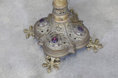 Lot 10 - A pair of tall brass candlesticks