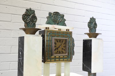 Lot 201 - A French Art Deco bronze-mounted onyx clock garniture