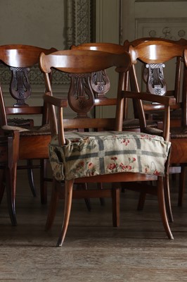 Lot 61 - ☘ A composed set of fourteen Biedermeier walnut dining chairs