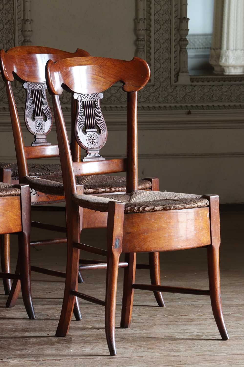 Lot 61 - ☘ A composed set of fourteen Biedermeier walnut dining chairs