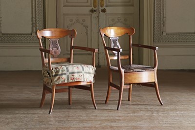 Lot 61 - ☘ A composed set of fourteen Biedermeier walnut dining chairs