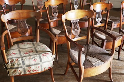 Lot 61 - ☘ A composed set of fourteen Biedermeier walnut dining chairs