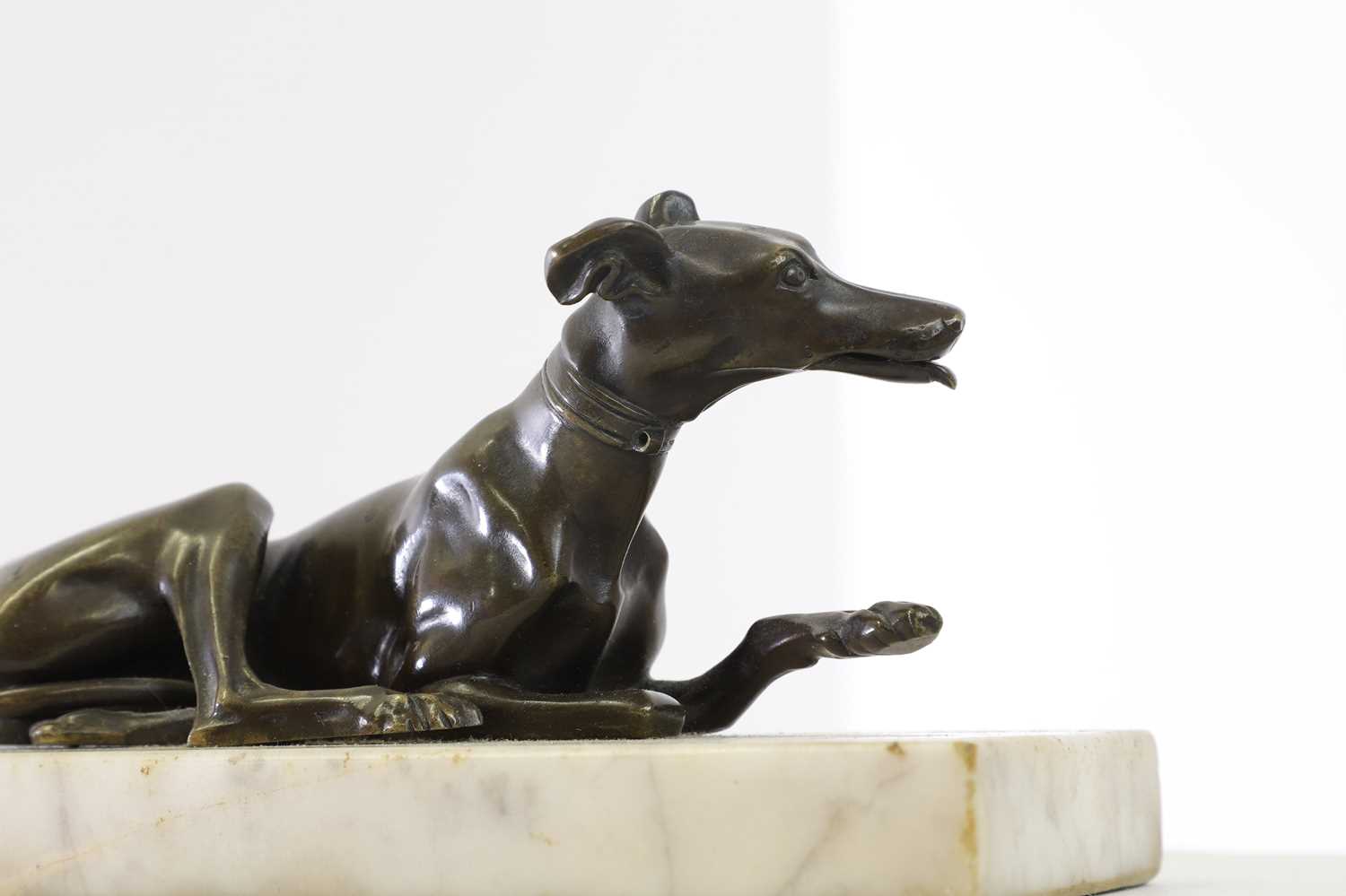 Lot 362 - A small bronze figure of a greyhound