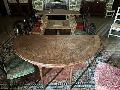 Lot 86 - A large circular walnut extending dining table