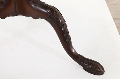 Lot 130 - A George III-style carved mahogany tripod table