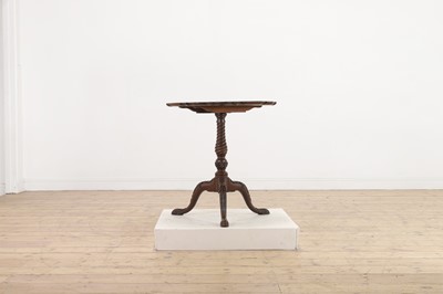 Lot 130 - A George III-style carved mahogany tripod table