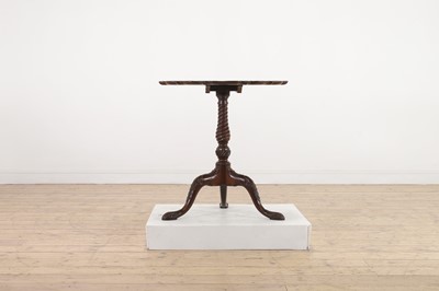 Lot 130 - A George III-style carved mahogany tripod table