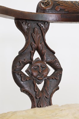 Lot 87 - A pair of George II-style carved walnut corner chairs
