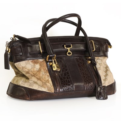 Lot 329 - A Gucci canvas and leather handbag