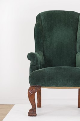 Lot 48 - A George II-style walnut wingback armchair
