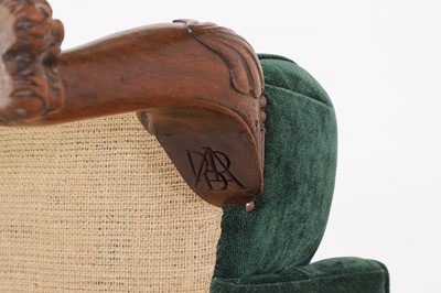 Lot 48 - A George II-style walnut wingback armchair