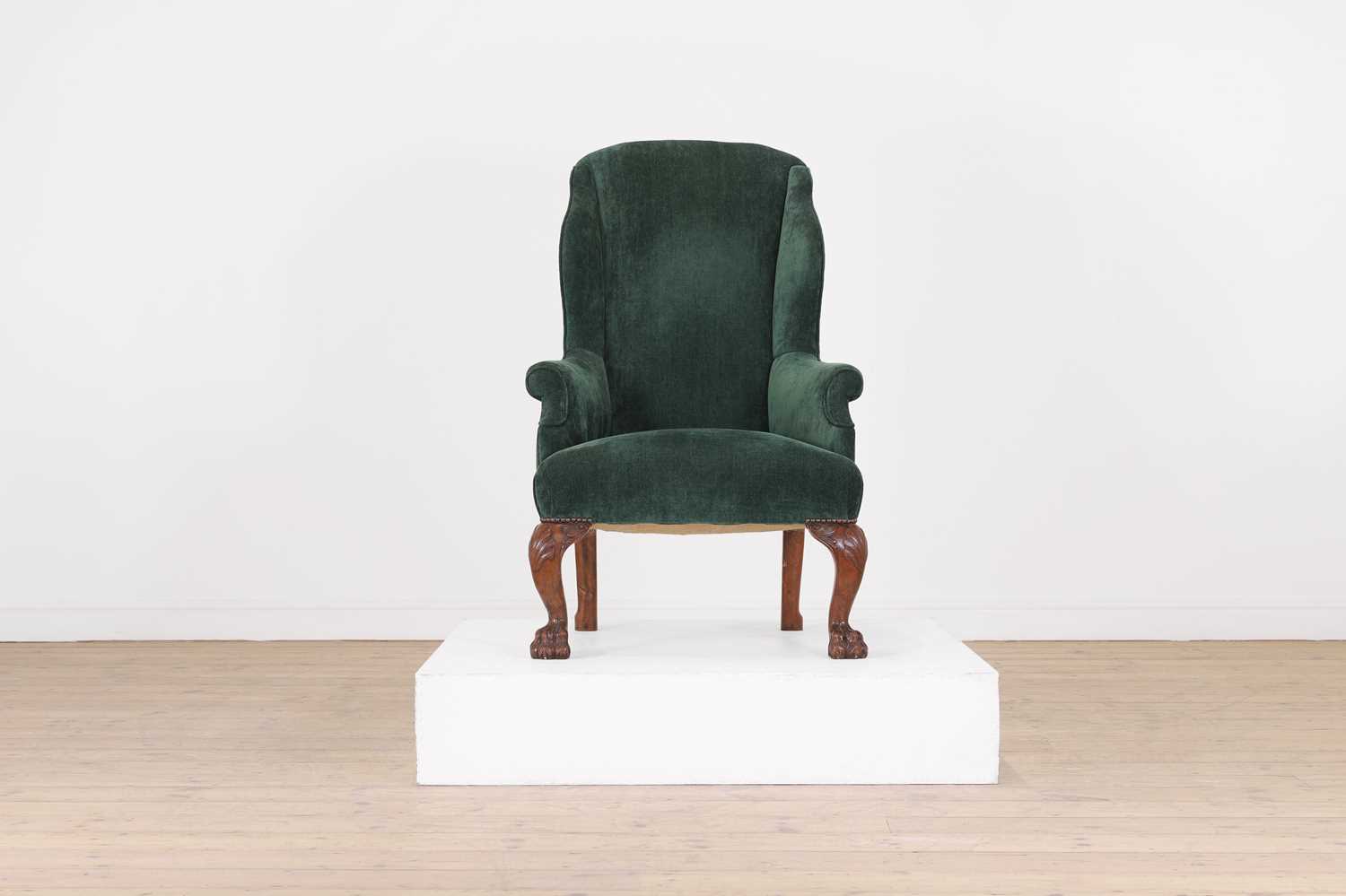 Lot 48 - A George II-style walnut wingback armchair