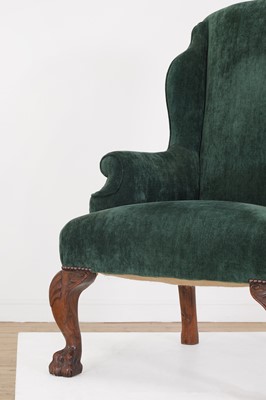 Lot 48 - A George II-style walnut wingback armchair