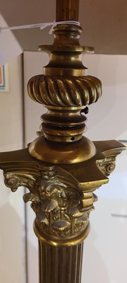 Lot 14 - A near pair of telescopic brass column floor lamps