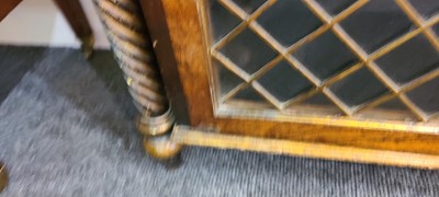 Lot 27 - A Regency rosewood, painted and parcel-gilt pier cabinet