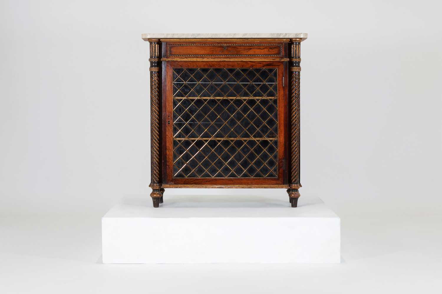 Lot 27 - A Regency rosewood, painted and parcel-gilt pier cabinet