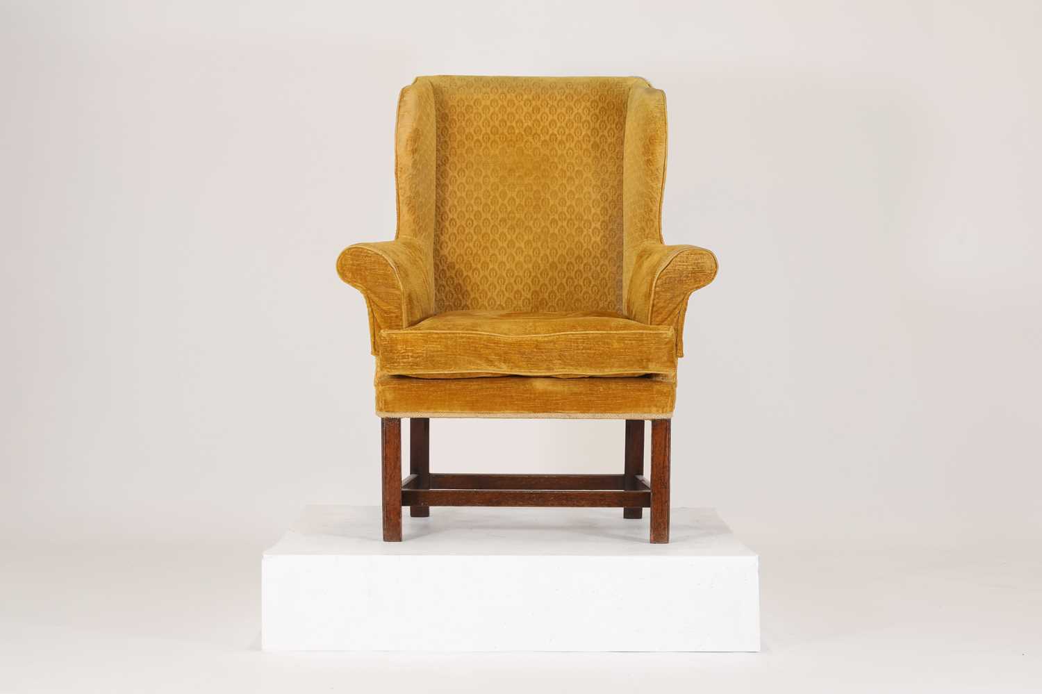 Lot 85 - A George III-style mahogany wingback armchair