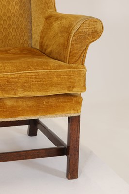 Lot 85 - A George III-style mahogany wingback armchair