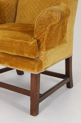 Lot 85 - A George III-style mahogany wingback armchair