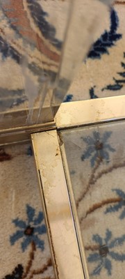 Lot 82 - A Lucite and brass coffee table