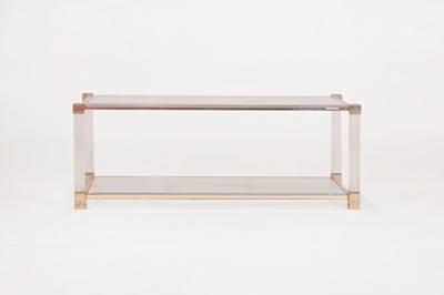 Lot 82 - A Lucite and brass coffee table