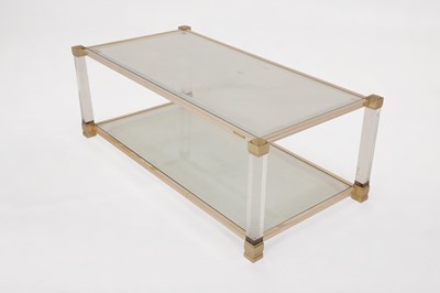 Lot 82 - A Lucite and brass coffee table