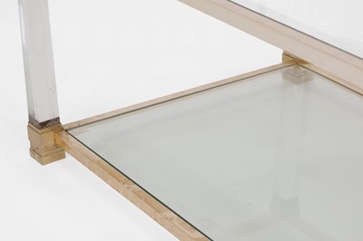 Lot 82 - A Lucite and brass coffee table