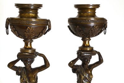 Lot 46 - A pair of Louis XVI patinated bronze and white marble candlesticks
