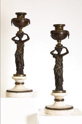 Lot 46 - A pair of Louis XVI patinated bronze and white marble candlesticks