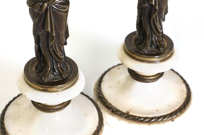 Lot 46 - A pair of Louis XVI patinated bronze and white marble candlesticks