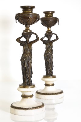 Lot 46 - A pair of Louis XVI patinated bronze and white marble candlesticks