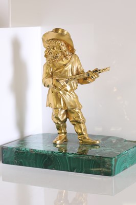Lot 72 - A gilt-bronze figure of a musician
