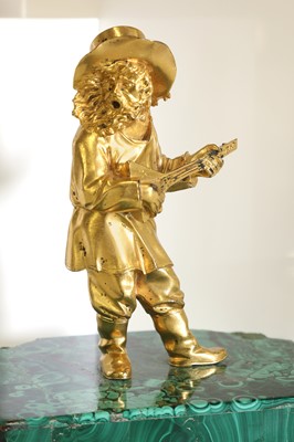 Lot 72 - A gilt-bronze figure of a musician