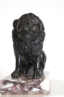 Lot 58 - A bronze model of a crouching lion