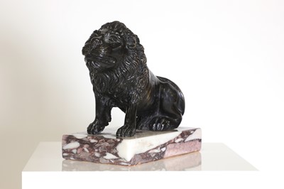 Lot 58 - A bronze model of a crouching lion