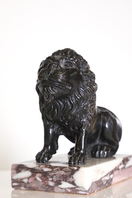 Lot 58 - A bronze model of a crouching lion