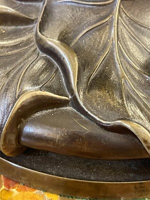 Lot 69 - A pair of patinated bronze table lamps