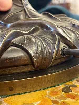 Lot 69 - A pair of patinated bronze table lamps