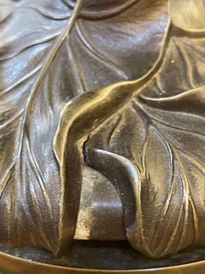 Lot 69 - A pair of patinated bronze table lamps