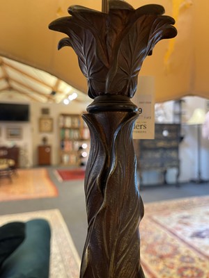 Lot 69 - A pair of patinated bronze table lamps