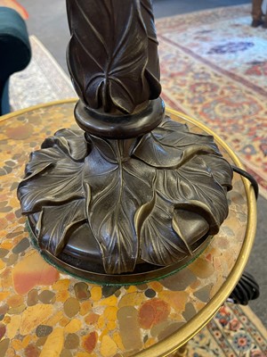 Lot 69 - A pair of patinated bronze table lamps